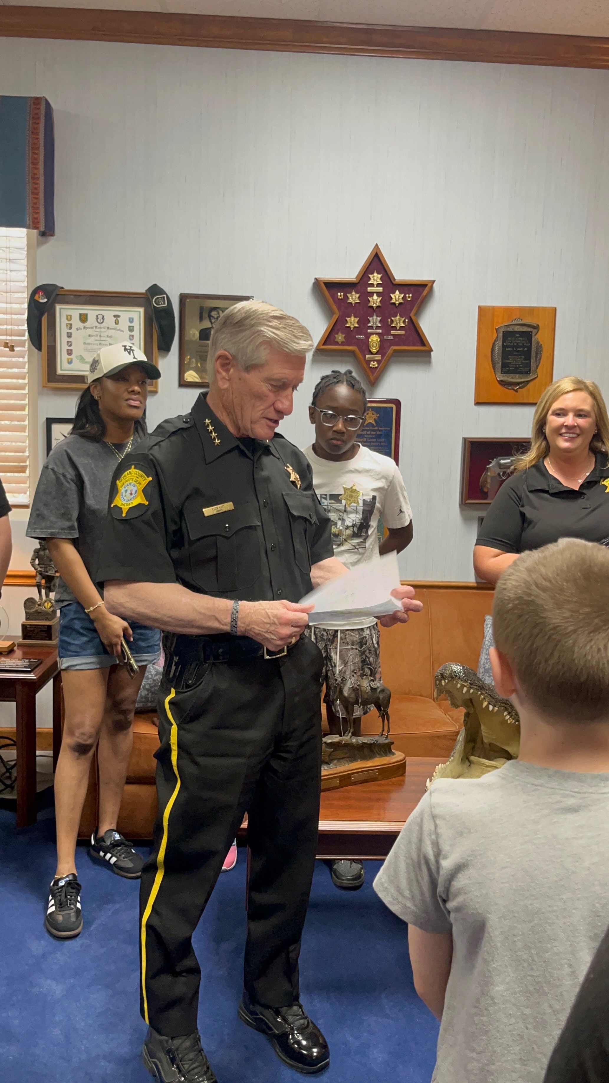 Deputy presenting a K-9 dog to co-op students